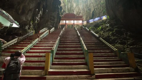 Batu Caves Staircase with Monkeys Playing and Moving Between Steps Stock Footage 334721279