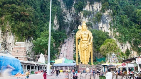 Batu caves statue with a huge staircase in Malaysia Time Lapse Stock Footage 124267036