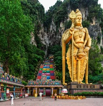 Batu Caves Temple Complex with Golden Lord Murugan Statue and Vibrant Stairs Stock Photos