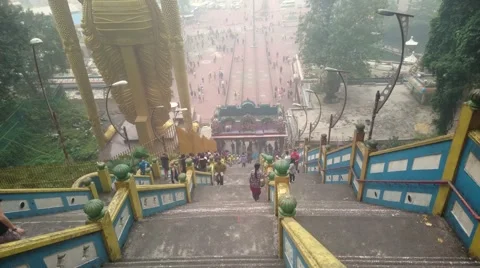 Batu Caves - View On Steps Looking Towards Statue. Pan Up Video stock 56059199
