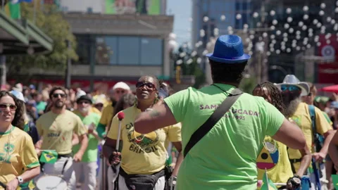 Batucada Leader Directs Drummers at Seattle Street Festival Stock Footage 345530432