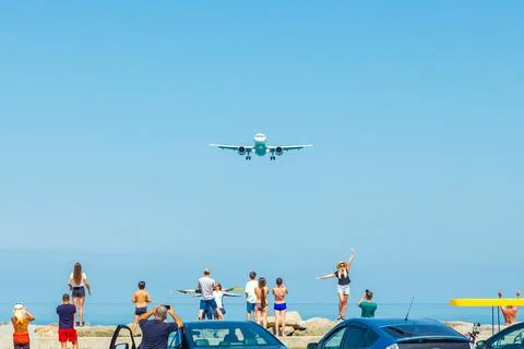 Batumi, Georgia, August 2, 2022: tourists and landing plane Stock Photos