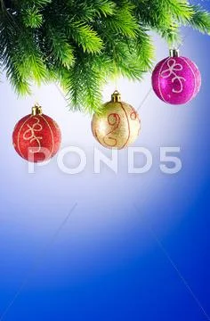 Baubles on christmas tree in celebration concept Stock Photos