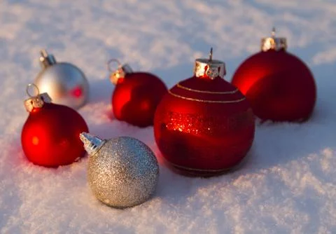 Baubles in snow Stock Photos