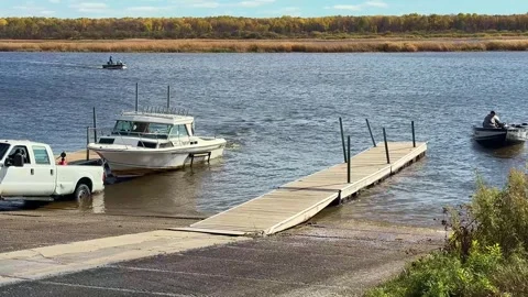 BAUDETTE, MN - 29 OCT 2025: Boat landing scene in northern Minnesota Stock Footage 322720566