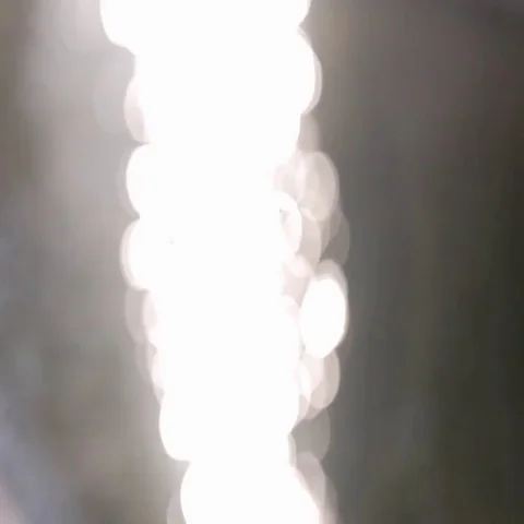 Bautiful Bokeh of Sun Glares Reflected on Water Stock Footage 69494618
