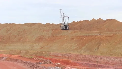 In a bauxite mining career, a dragline performs hard work. Overall plan. Stock Footage 122215982