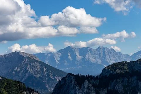 Bavarian alps mountain range with clouds and blue sky Stock Photos