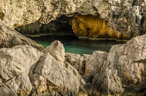 Bay and cave Stock Photos