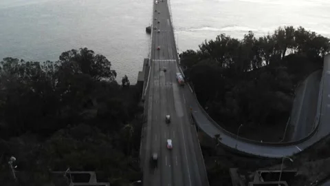 Bay Bridge During Sunset with Rush Hour Traffic, Aerial Tilt Down View Stock Footage 146560891