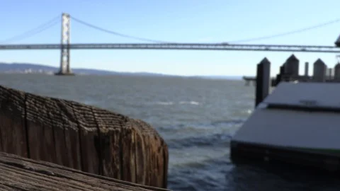 Bay Bridge from Ferry Building Dock Bokeh Shot 動画素材 100379755