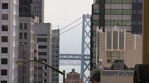 Bay Bridge seen through streets of San Francisco Stock Footage