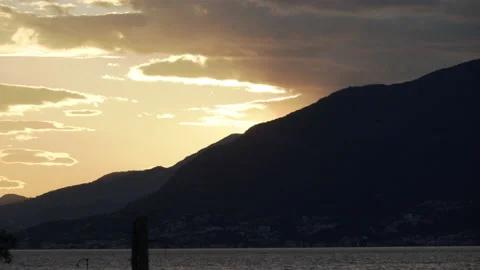 Bay of Kotor orange sunset with clouds over mountains Video stock 143895073