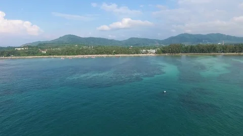 Bay with a pier, a tropical landscape, constructions ashore, shooting from air Stock-Footage 82071807
