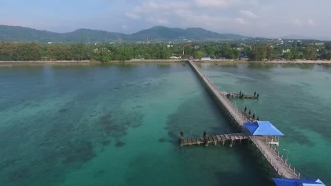 Bay with a pier, a tropical landscape, constructions ashore, shooting from air Video stock 82072301