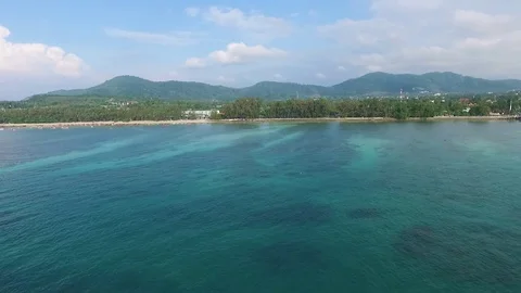 Bay with a pier, a tropical landscape, constructions ashore, shooting from air Stock-Footage 82072403