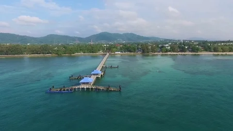 Bay with a pier, a tropical landscape, constructions ashore, shooting from air Stock-Footage 82072410
