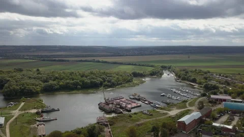 Bay of the river with a technical base. Cranes and warehouses, repair ships. Stock Footage 145932702