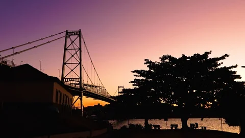 Bay at sunset with Hercílio Luz bridge in the background, in Florianópolis, Stock Footage 129326002