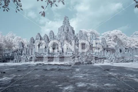 Bayon Temple in Angkor Tom in blue channel infrared Stock Photos