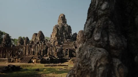 Bayon Temple Reveal from Tree Foreground in Siem Reap Cambodia Stock Footage 333523227
