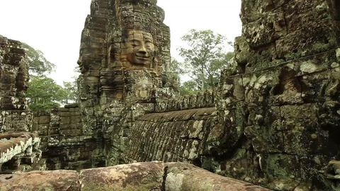 Bayon temple smooth glide with stone faces Stock Footage 76381421