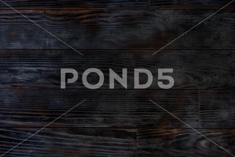 BBQ background. Burnt wooden Board texture. Burned scratched hardwood surface Stock Photos