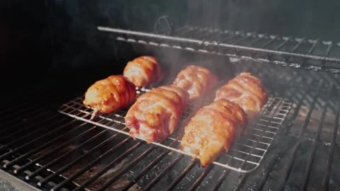 BBQ Bacon Wrapped Smoked Chicken Thighs 24fps Stock Footage 335704042
