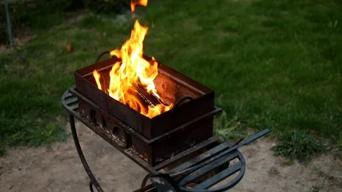 BBQ. Barbecue in the backyard in the late evening in the summer . Flames of fire Stock Footage 112949575