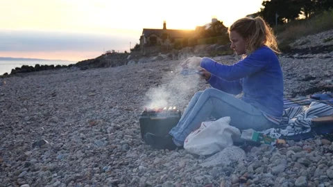 BBQ on Beach At Sunset 4K Slow Motion Stock Footage 212077083