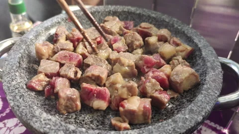 Bbq Beef Fried in Stone Pot During an Outdoor Dining Stock Footage 165639067