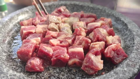 Bbq Beef Fried in Stone Pot During an Outdoor Dining Stock Footage 165639078