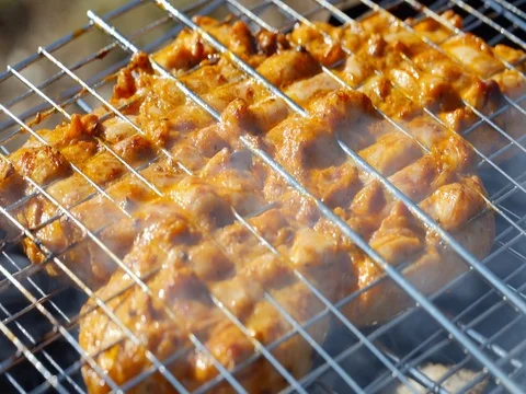 BBQ, chicken fried on a grill. dolly shot Stock Footage 74067131