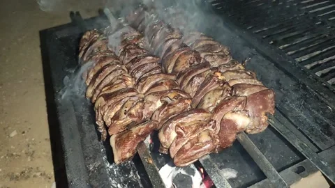 Bbq chicken hearts low light at evening. with sound. Stock Footage 145954723
