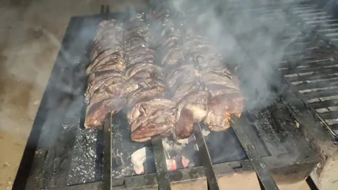 Bbq chicken hearts low light at evening. with sound. Stock Footage 145954726