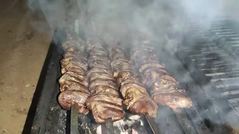 Bbq chicken hearts low light at evening. with sound. Stock Footage 145954729