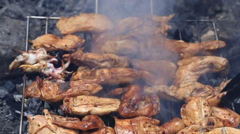 Bbq chicken meat on a grill with charcoal Stock Footage