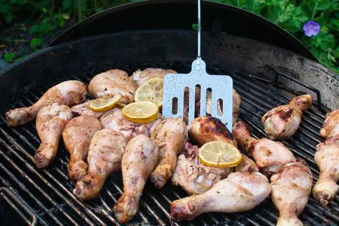 BBQ chicken with spatula Stock Photos