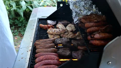 BBQ Close-up shot. Guy is opening and closing BBQ grill. Stock Footage 226355278