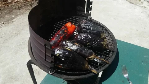 Bbq eggplant on a grill with charcoal Stockbeeldmateriaal 136541073