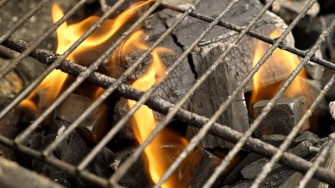 BBQ grill charcoal burning with an open flame in slow motion isolated Stock Footage 105991929