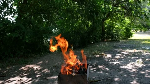 Bbq grill flame and hot burning grill, outdoors cooking food.4K Stock Footage 133795702