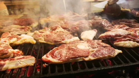 Bbq grill full of meat, hand cuts meat slice checking if it is ready bbq party 스톡 동영상 161606365