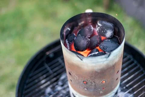 BBQ Grill Pit Glowing And Flaming Hot Charcoal Briquettes coal Food Backgroun Stock Photos
