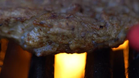 Bbq Hamburger On A Grill With Flames Stock Footage 130162458