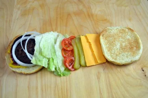 BBQ Hamburger With Toppings Stock Photos