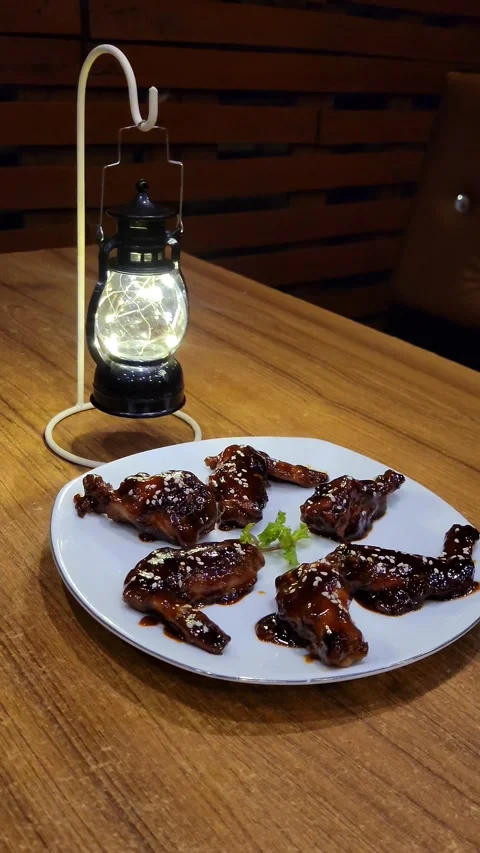 BBQ Hot Wings With a Small Black Lamp Stock Footage 285621808