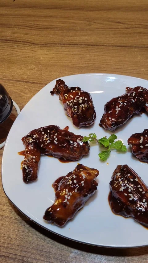 BBQ Hot Wings With a Small Black Lamp Stock Footage 285621809