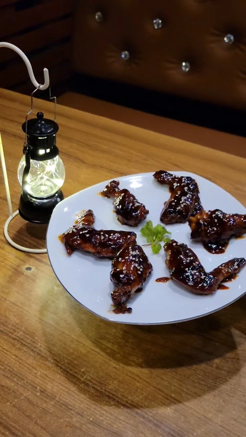 BBQ Hot Wings With a Small Black Lamp Stock Footage 285625449