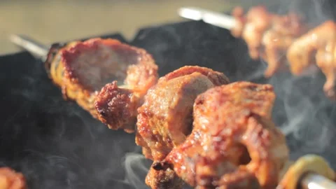 BBQ meat is being cooked on the open fire 스톡 동영상 133228406